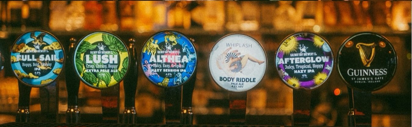 Six tap badges along the bar: Full Sail, Lush, Althea, Body Riddle by Whiplash, Afterglow and Guinness.